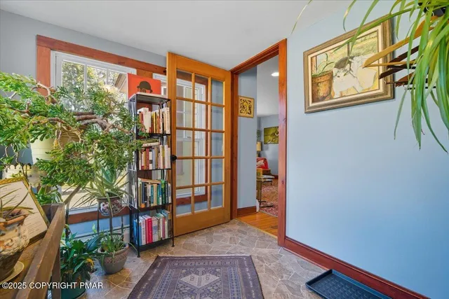 a kitchen with stainless steel appliances kitchen island granite countertop a refrigerator stove and sink