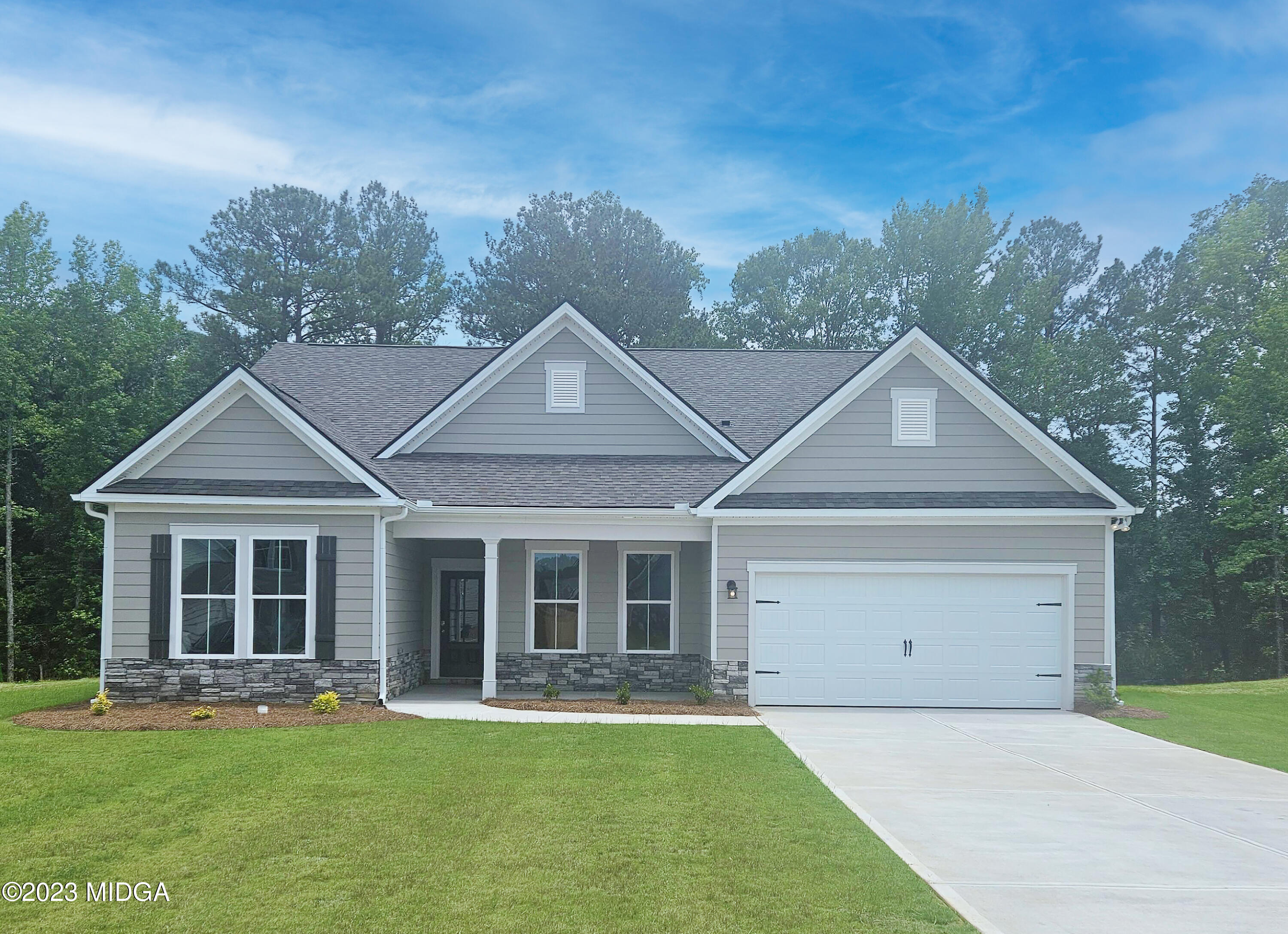 front view of a house with a yard