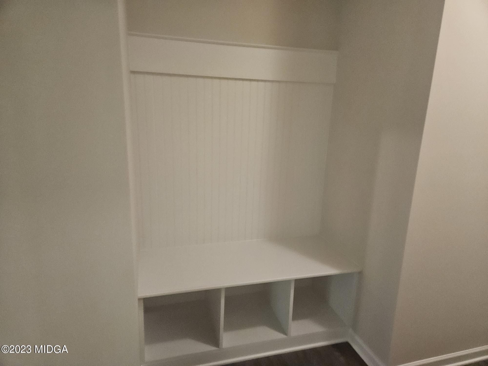 231 Presidents Way Forsyth, GA 31029 - Photo 17 of 32 a view of walk in closet with empty racks
