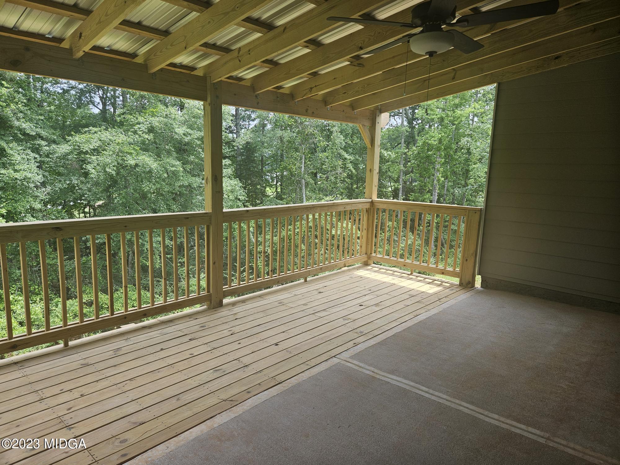 231 Presidents Way Forsyth, GA 31029 - Photo 18 of 32 a view of balcony with wooden floor