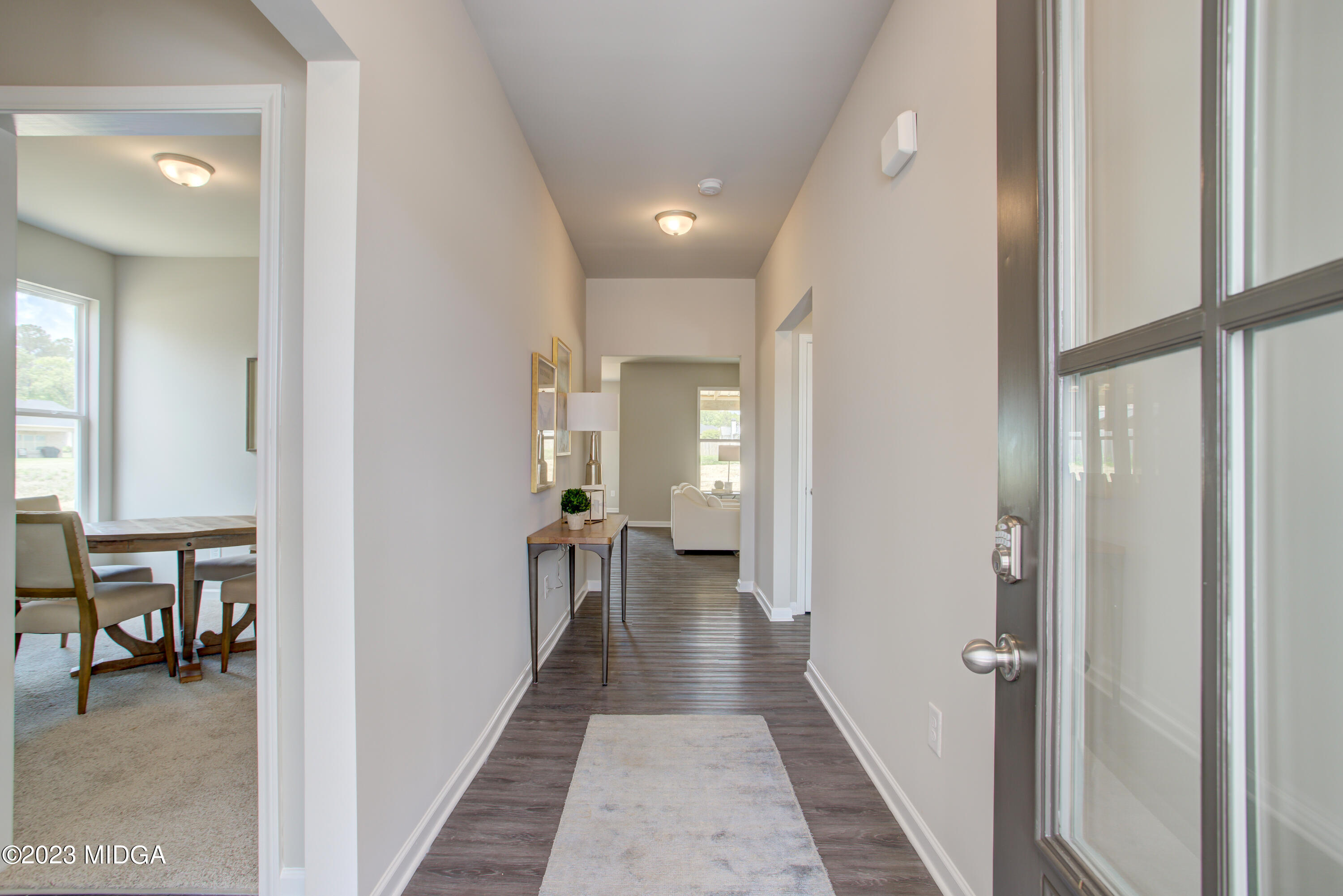 231 Presidents Way Forsyth, GA 31029 - Photo 3 of 32 a view of a hallway with a livingroom and furniture