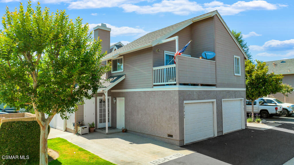 1854 Rory Lane, Unit 6 Simi Valley, CA 93063 - Photo 1 of 26 a view of a house with a yard