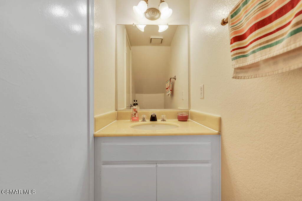 1854 Rory Lane, Unit 6 Simi Valley, CA 93063 - Photo 11 of 26 a bathroom with a sink and a mirror