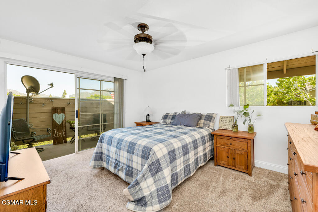 1854 Rory Lane, Unit 6 Simi Valley, CA 93063 - Photo 12 of 26 a bedroom with a bed and large window