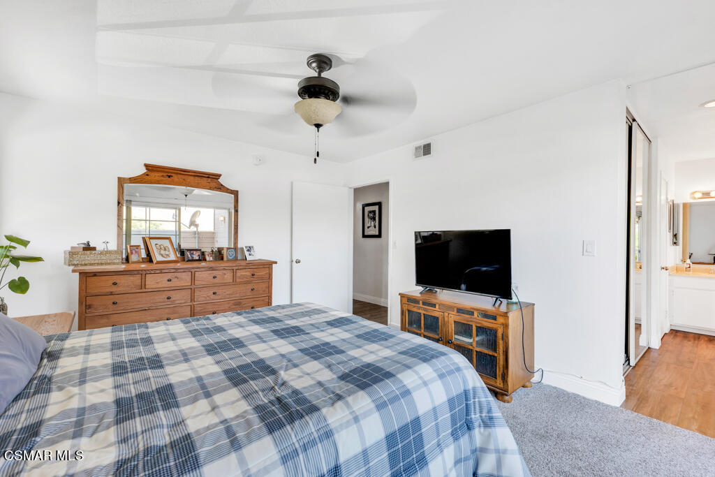 1854 Rory Lane, Unit 6 Simi Valley, CA 93063 - Photo 13 of 26 a bedroom with a bed and a flat screen tv