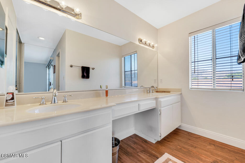 1854 Rory Lane, Unit 6 Simi Valley, CA 93063 - Photo 15 of 26 a bathroom with a double vanity sink and a mirror