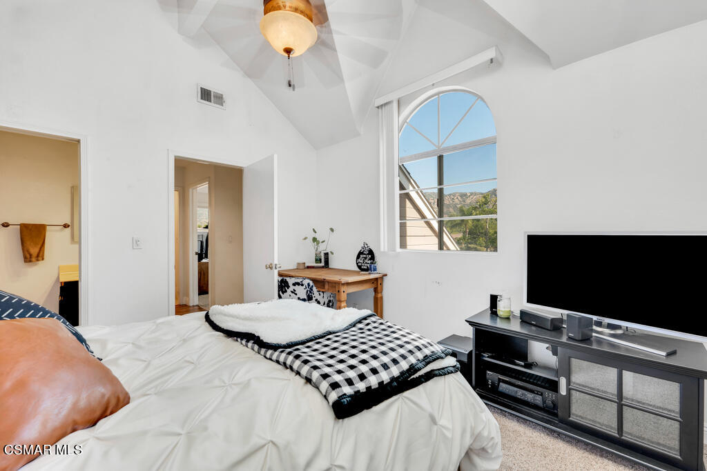 1854 Rory Lane, Unit 6 Simi Valley, CA 93063 - Photo 19 of 26 a bedroom with a bed and a flat screen tv