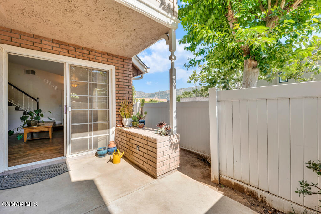 1854 Rory Lane, Unit 6 Simi Valley, CA 93063 - Photo 23 of 26 a backyard of a house with barbeque oven and outdoor seating