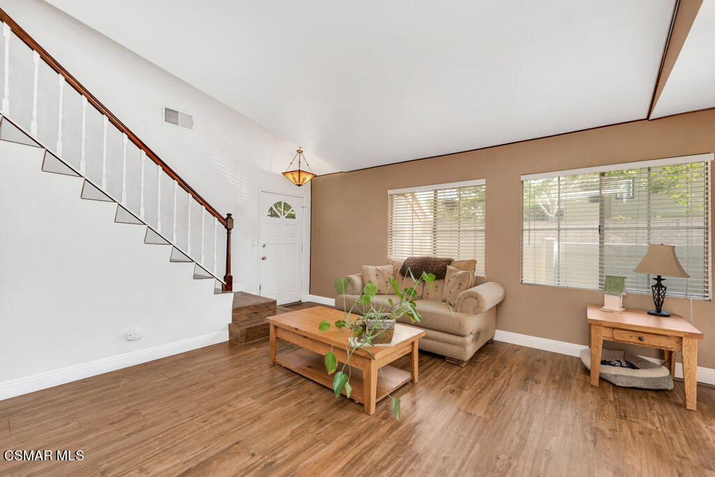 1854 Rory Lane, Unit 6 Simi Valley, CA 93063 - Photo 5 of 26 a living room with furniture and a large window