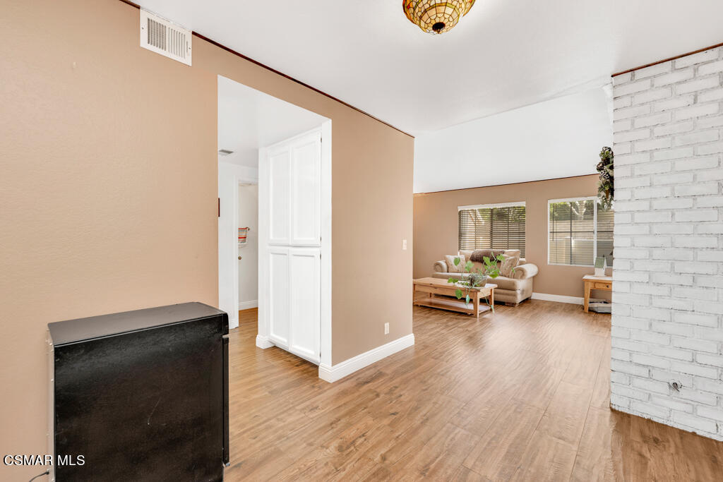 1854 Rory Lane, Unit 6 Simi Valley, CA 93063 - Photo 8 of 26 a view of a livingroom with a flat screen tv and staircase