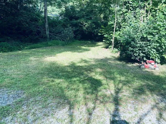 a view of a car parked in the yard