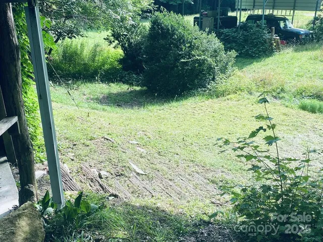 a view of backyard with outdoor seating