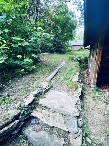 a bathroom with a shower and a window