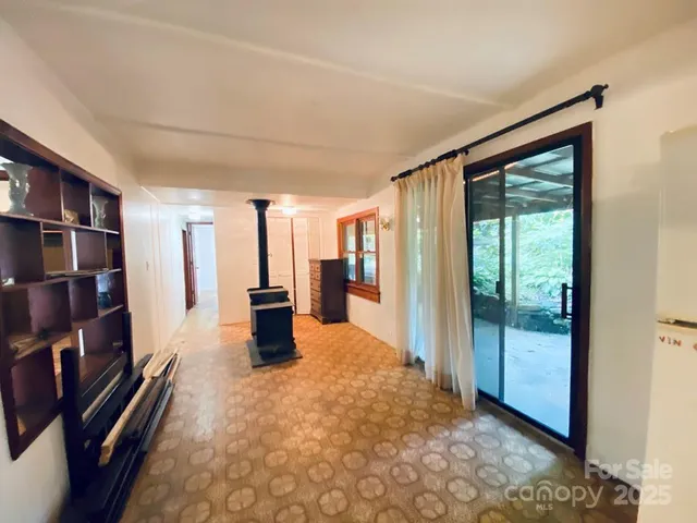 a large room with lots of furniture and a book shelf