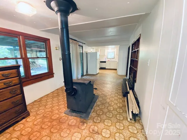 a view of entryway with a floor to ceiling window and stairs
