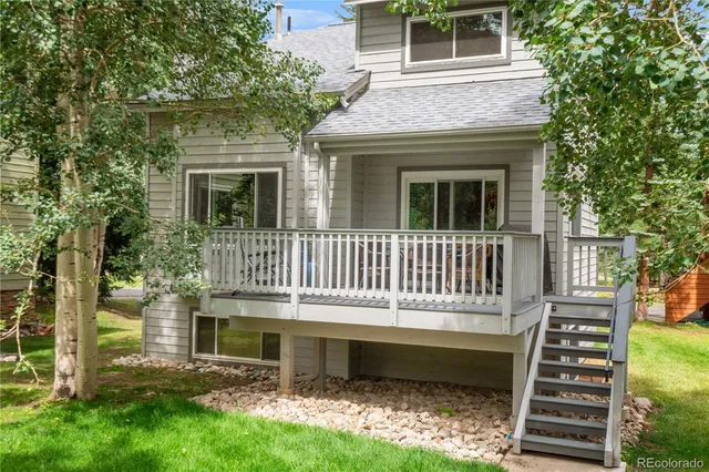 a view of wooden door and a window
