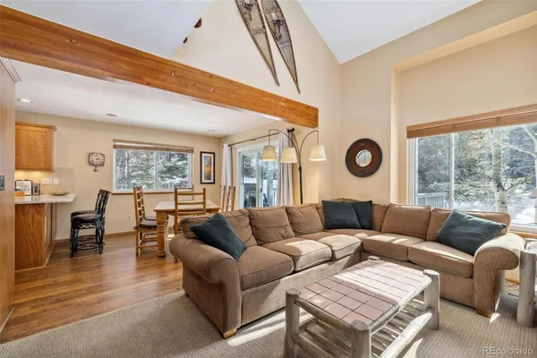 a living room with a fireplace a flat screen tv and a fireplace