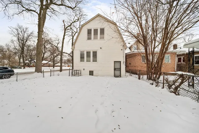 a view of a white house with a snow