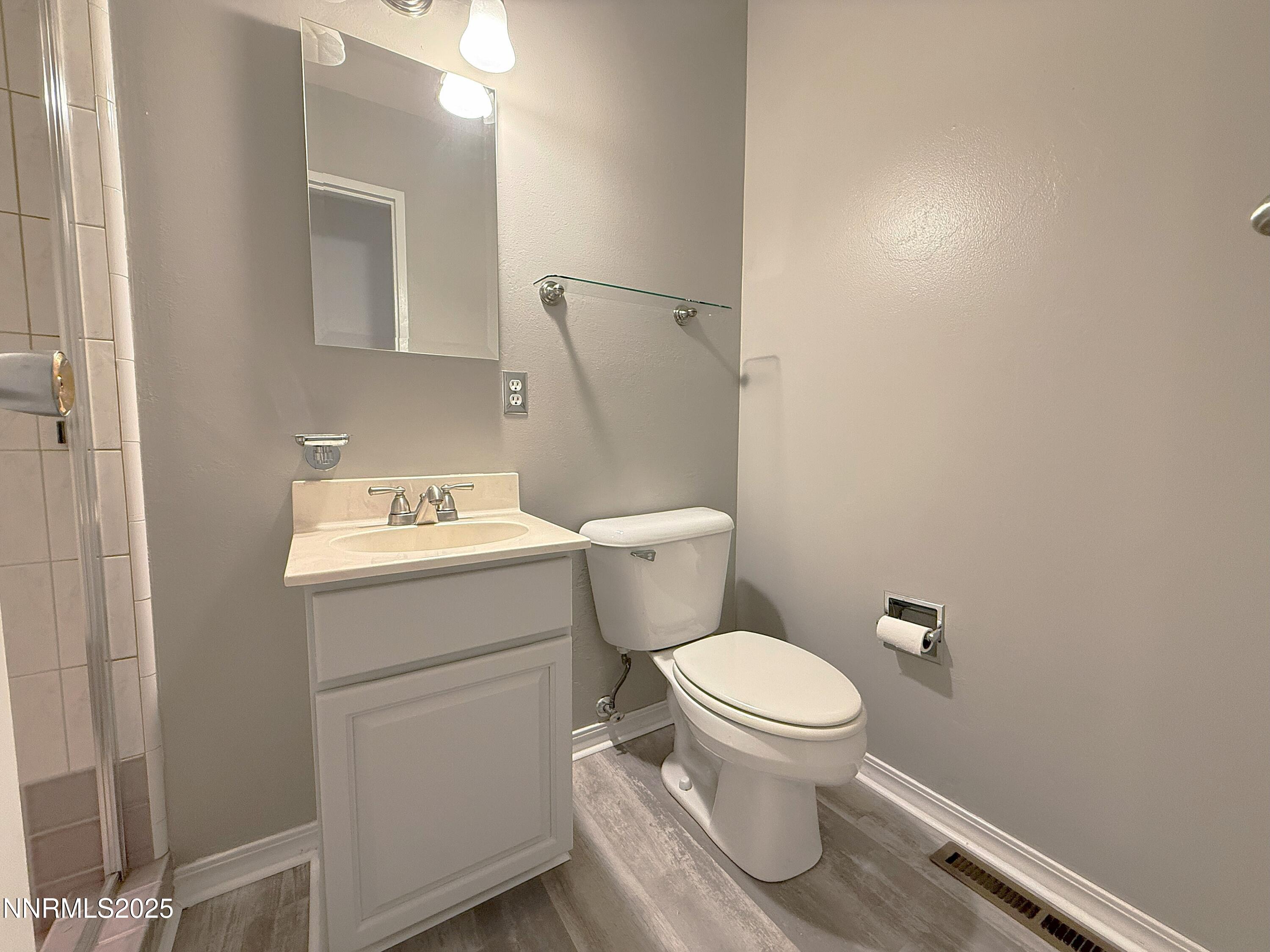1480 Grandview Avenue Reno, NV 89503 - Photo 12 of 42 a bathroom with a sink toilet and a mirror