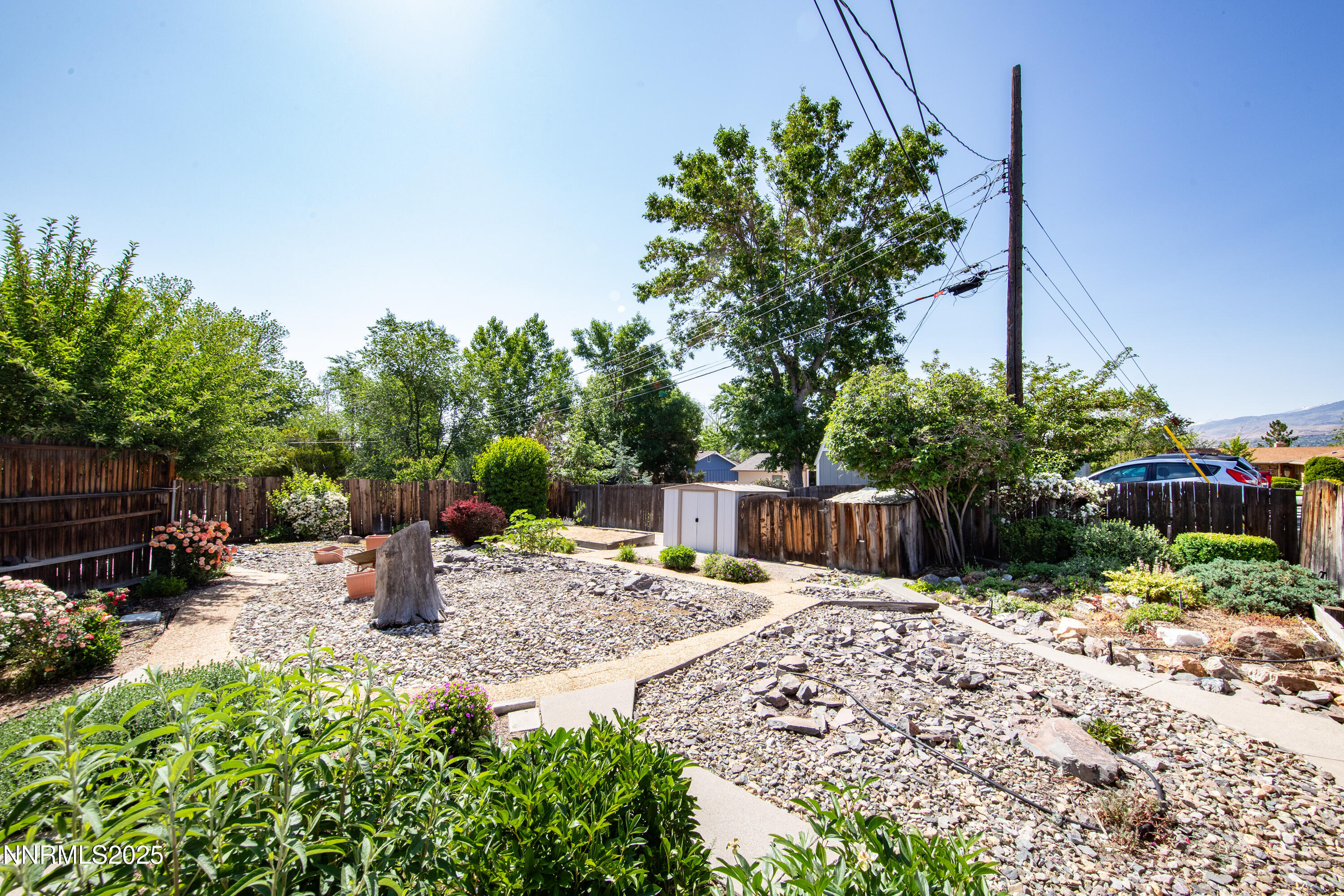 1480 Grandview Avenue Reno, NV 89503 - Photo 30 of 42 a view of backyard with a table and chairs under an umbrella