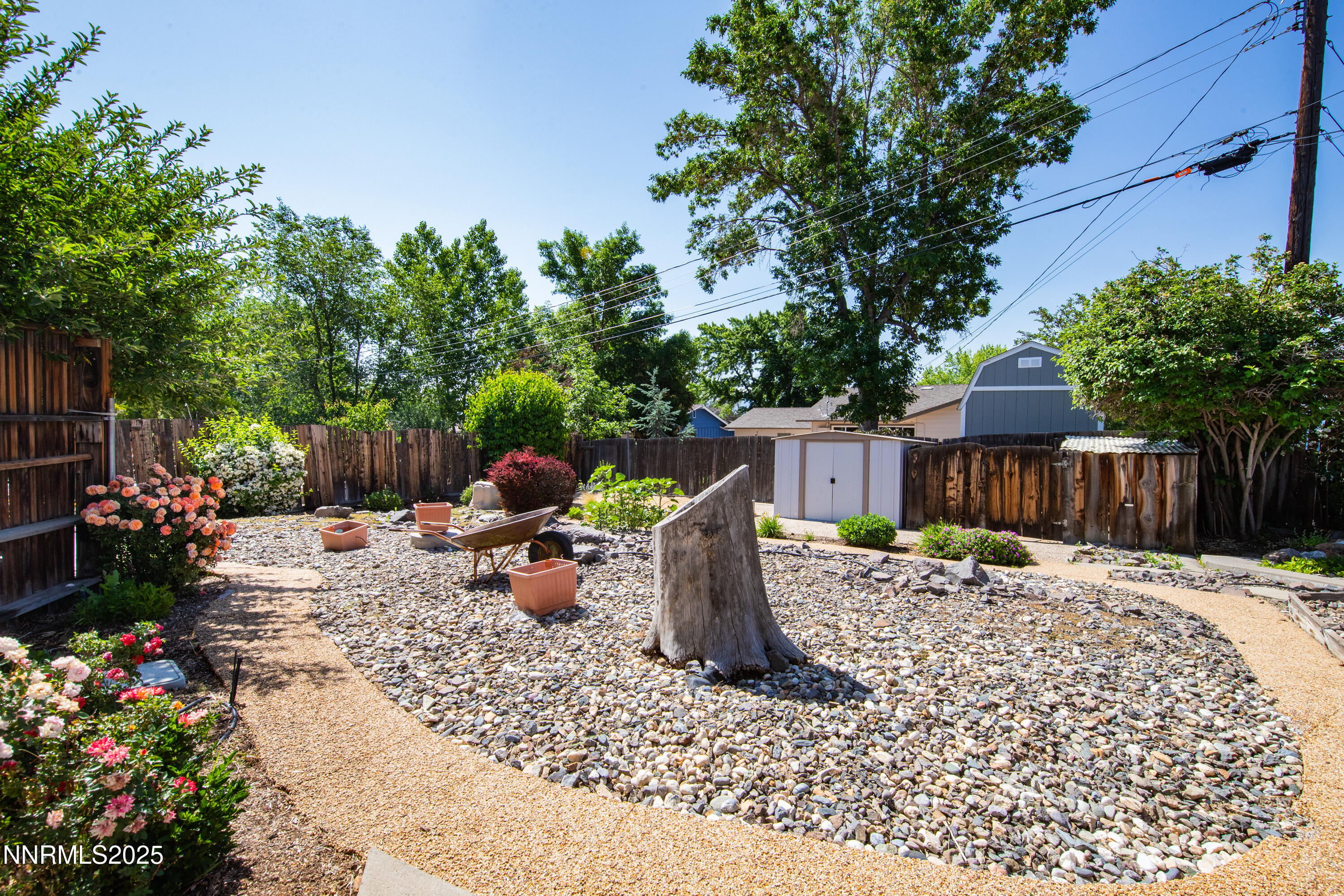 1480 Grandview Avenue Reno, NV 89503 - Photo 33 of 42 a backyard of a house with a swing chair and wooden fence