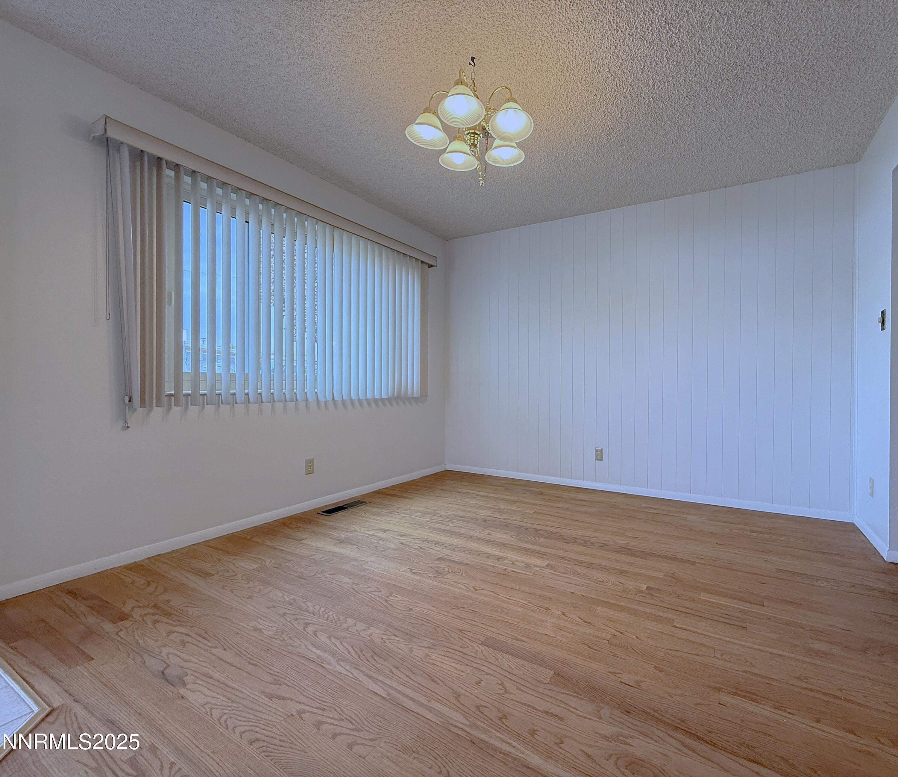 1480 Grandview Avenue Reno, NV 89503 - Photo 7 of 42 a view of an empty room with window and chandelier fan