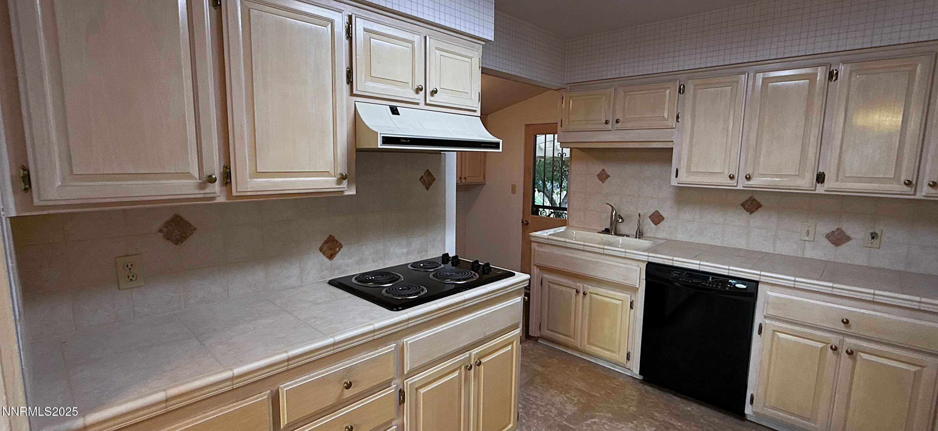 1480 Grandview Avenue Reno, NV 89503 - Photo 9 of 42 a kitchen with stainless steel appliances granite countertop a sink a stove and cabinets