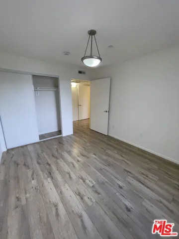 a view of an empty room and a sink