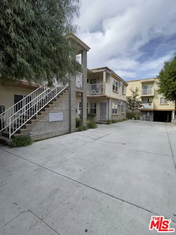 a view of a house with a street