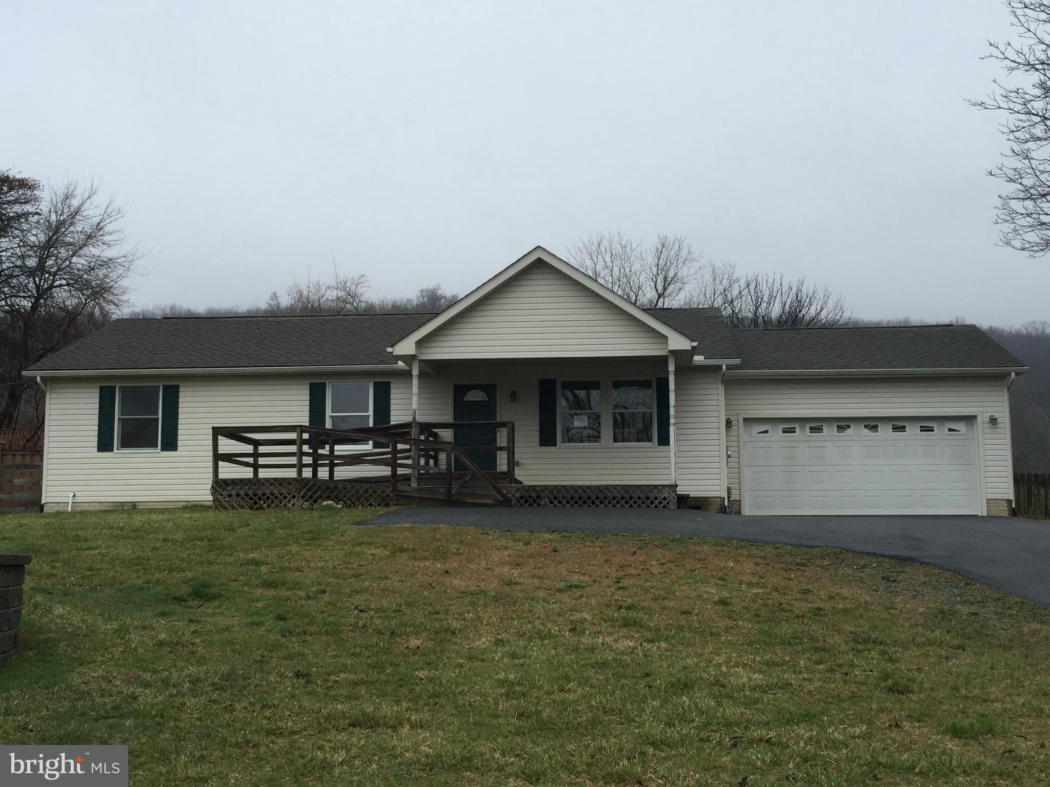 7700 Edgewood Church Road Frederick, MD 21702 - Photo 1 of 24 a front view of a house with a garden and yard