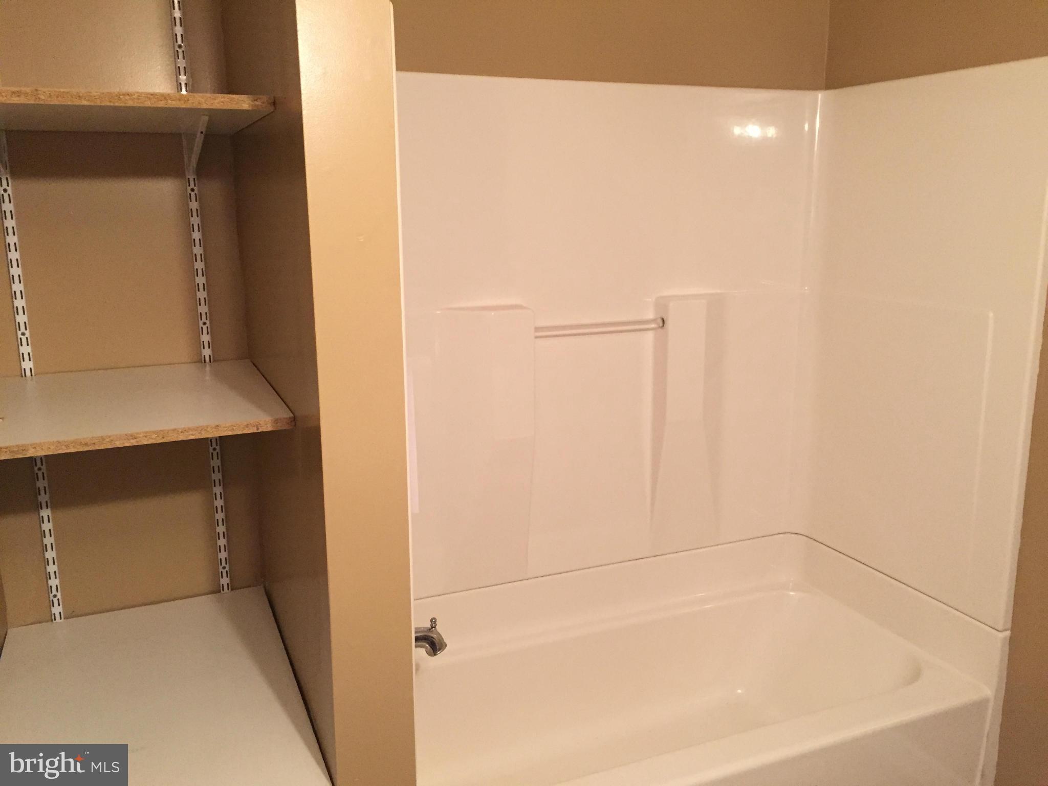 7700 Edgewood Church Road Frederick, MD 21702 - Photo 18 of 24 a bathroom with a bathtub