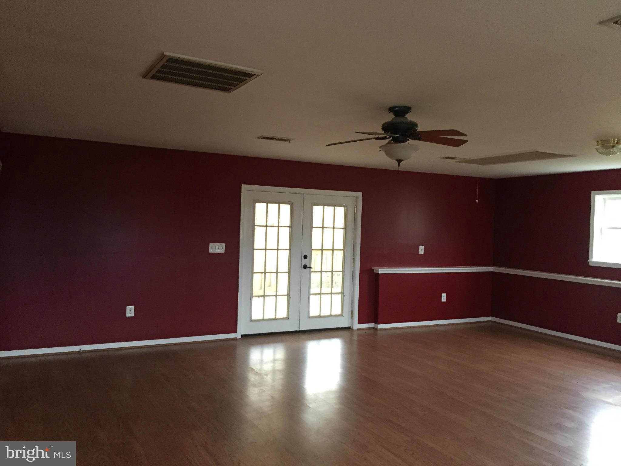7700 Edgewood Church Road Frederick, MD 21702 - Photo 6 of 24 a view of an empty room with a window and wooden floor