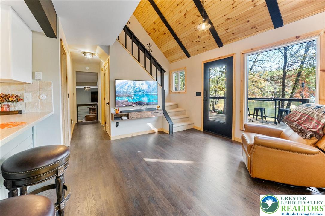 809 Boulder Court North Hawley, PA 18428 - Photo 20 of 43 a living room with furniture and a floor to ceiling window