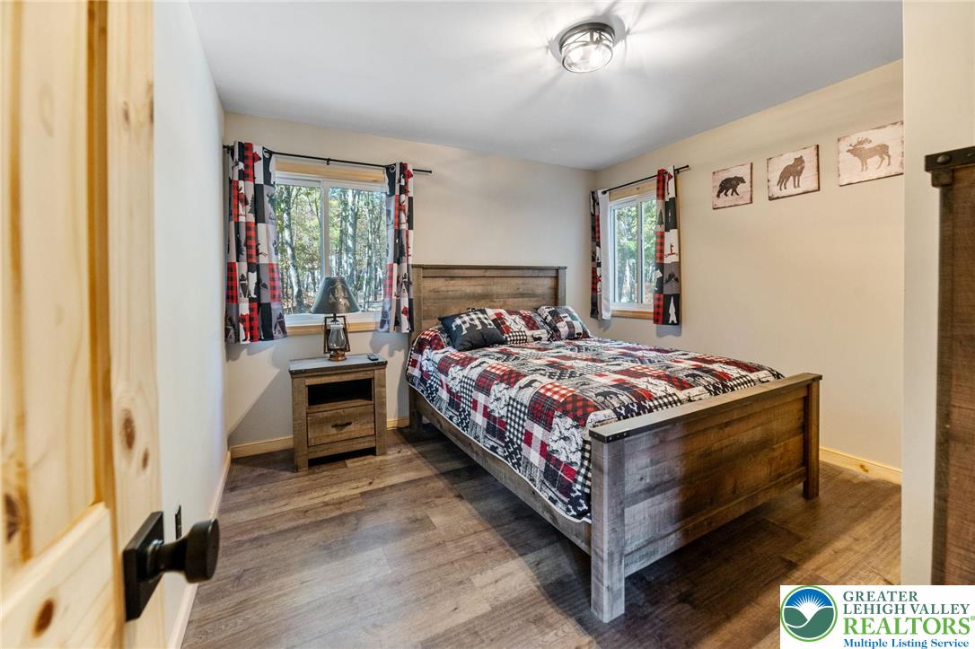 809 Boulder Court North Hawley, PA 18428 - Photo 21 of 43 a bedroom with a bed and a window