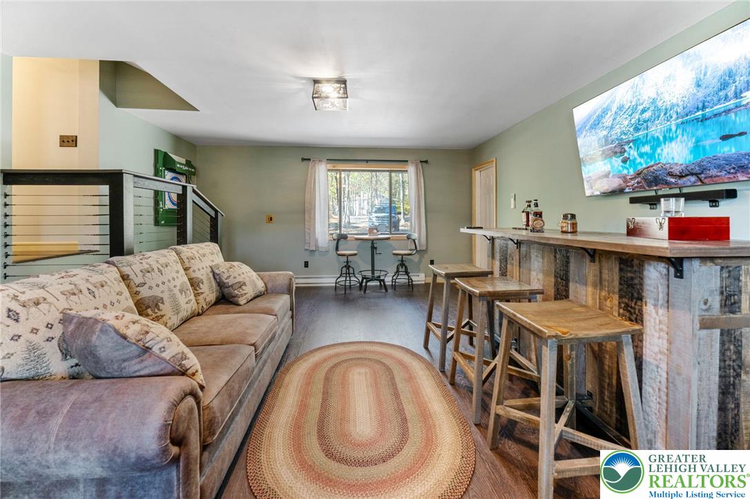 809 Boulder Court North Hawley, PA 18428 - Photo 24 of 43 a living room with furniture and a flat screen tv