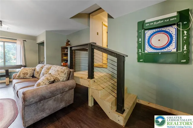 a bedroom with furniture and a window