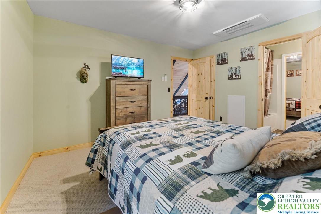 809 Boulder Court North Hawley, PA 18428 - Photo 31 of 43 a bedroom with a bed and a closet