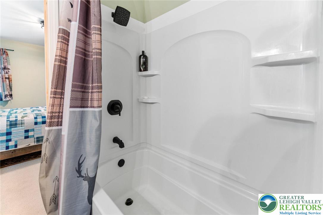 809 Boulder Court North Hawley, PA 18428 - Photo 33 of 43 a bathroom with a bathtub and shower