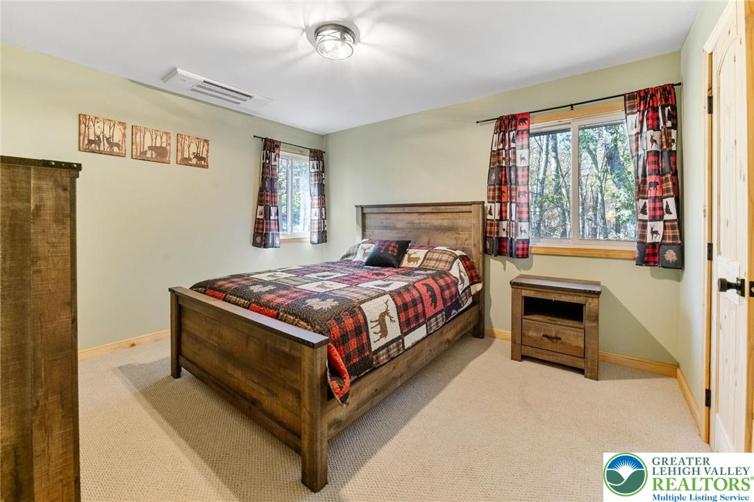 809 Boulder Court North Hawley, PA 18428 - Photo 34 of 43 a bedroom with a bed and a window