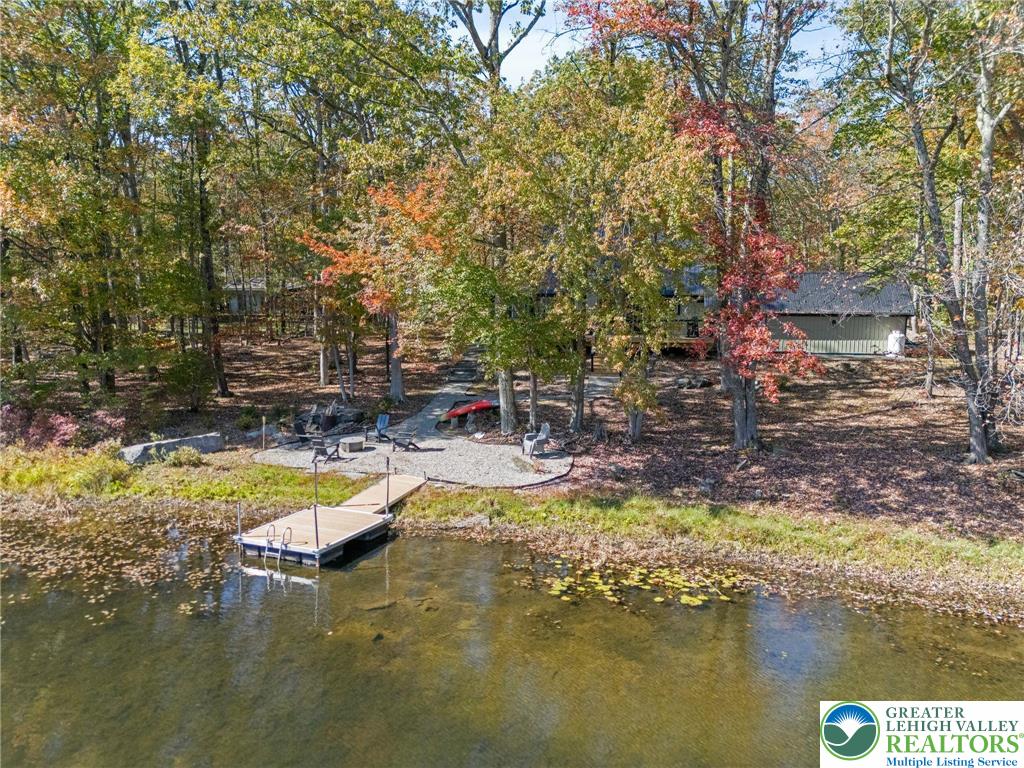809 Boulder Court North Hawley, PA 18428 - Photo 41 of 43 a view of swimming pool with lawn chairs and plants