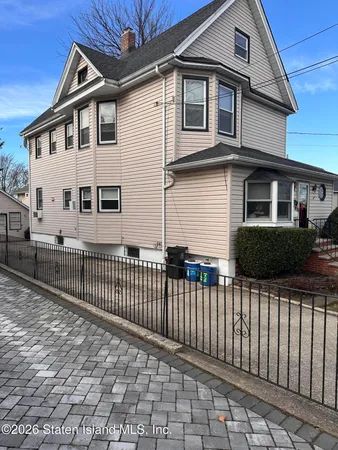 a front view of a house with a small yard