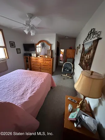 a room with water heater and hardwood