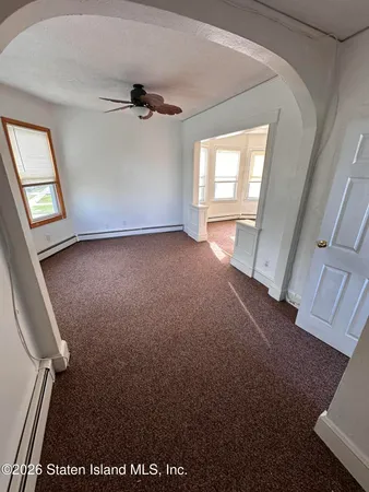 a view of an empty room and window