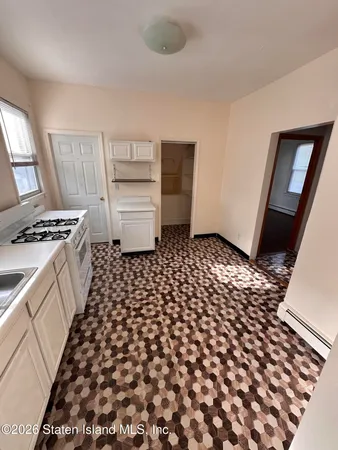 a bathroom with a black white checkered floor