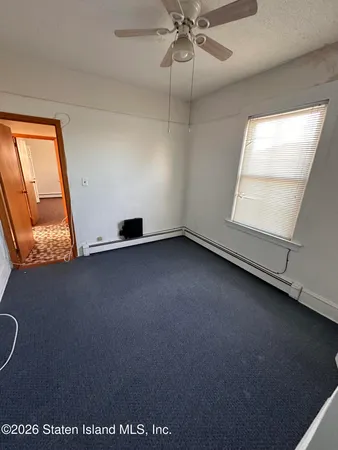 a view of storage and utility room with two washing machine