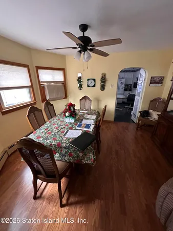 a view of a livingroom with furniture and a window