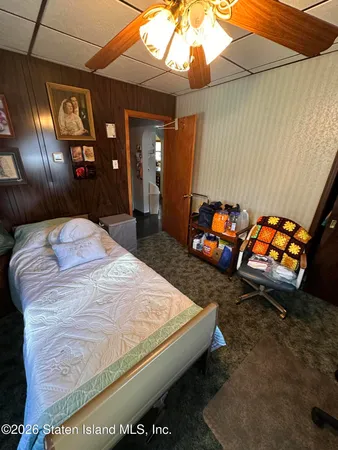 a bedroom with bed and window