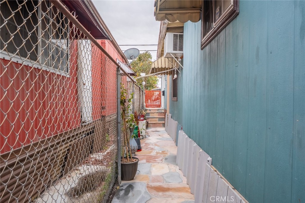 16002 Atlantic Avenue, Unit C11 Compton, CA 90221 - Photo 12 of 19 a view of a pathway of a house