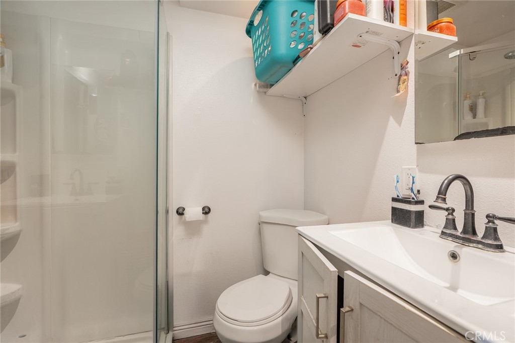 16002 Atlantic Avenue, Unit C11 Compton, CA 90221 - Photo 16 of 19 a bathroom with a sink a toilet and shower