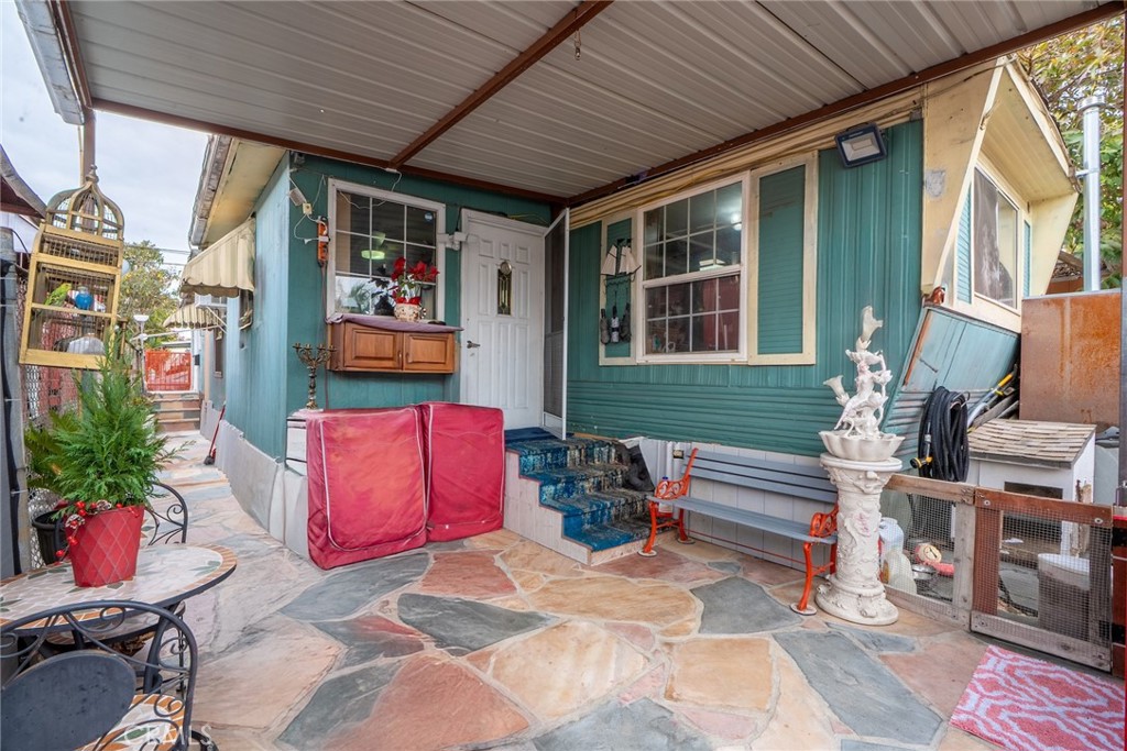 16002 Atlantic Avenue, Unit C11 Compton, CA 90221 - Photo 2 of 19 a backyard of a house with outdoor seating